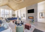 Thumbnail 27 of 30 - community room with couches and chairs and a fireplace at Sycamore at Tyvola, North Carolina, 28217