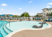 Thumbnail 14 of 30 - resort style pool with lounge chairs on in-water ledge at Sycamore at Tyvola, Charlotte
