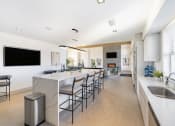 Thumbnail 24 of 30 - Community room kitchen with island and barstools at Sycamore at Tyvola, North Carolina