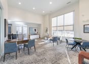 Thumbnail 30 of 30 - a living room with a large window and a table and chairs at Sycamore at Tyvola, Charlotte, NC, 28217