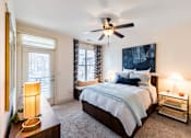 Thumbnail 4 of 28 - a bedroom with a large bed and a ceiling fan at Park and Kingston, Charlotte, North Carolina