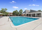 Thumbnail 21 of 41 - Swimming pool with lounge chairs on pool deck at Westwinds Apartments, Annapolis MD