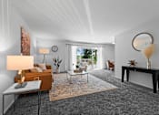 Thumbnail 2 of 20 - A living room with a grey carpet and a brown sofa.