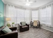 Thumbnail 19 of 42 - sitting room with chairs at The Grand Reserve at Tampa Palms Apartments, Florida, 33647