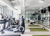 Thumbnail 20 of 36 - Fitness Center with cardio equipment at St. Marys Square Apartments, Raleigh, NC