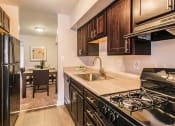 Thumbnail 1 of 12 - Updated kitchen at Brook View Apartments, Baltimore, 21209