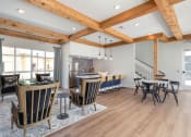 Thumbnail 13 of 15 - a dining room and living room with a table and chairs at Bristol at New Riverside, Bluffton, 29910