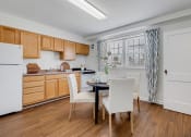 Thumbnail 3 of 9 - Kitchen with hardwood flooring and window  at Cross Country Manor Apartments, Baltimore