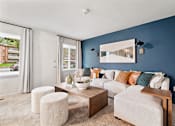 Thumbnail 6 of 23 - a living room with blue walls and a white couch at Falls Village Apartments, Maryland, 21209