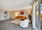 Thumbnail 2 of 16 - Living Room and Full Size Washer and Dryer at Kenilworth at Charles Apartments, Towson, Maryland