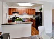 Thumbnail 1 of 16 - Dining Room with Open Kitchen at Kenilworth at Charles Apartments, Maryland