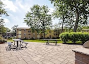 Thumbnail 21 of 35 - Community Grilling and Outdoor Dining Area at Kenilworth at Perring Park Apartments, Parkville, Maryland