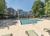 Thumbnail 9 of 20 - Swimming pool and sundeck at The Village Apartments, Raleigh