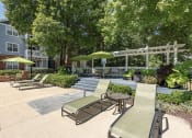 Thumbnail 10 of 20 - Sundeck loungers at The Village Apartments, North Carolina