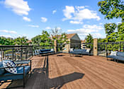 Thumbnail 4 of 20 - spacious deck with furniture and privacy fence at McDonogh Township Apartments, Owings Mills