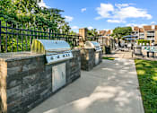 Thumbnail 7 of 20 - outdoor kitchen with two grilling stations at McDonogh Township Apartments, Maryland