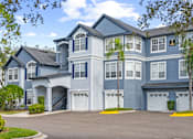 Thumbnail 41 of 42 - Building with 3 stories and garages attached at The Grand Reserve at Tampa Palms Apartments, Tampa, FL, 33647