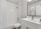 Thumbnail 15 of 35 - a bathroom with a bathtub and a sink Kenilworth at Perring Park Apartments, Parkville, MD 21234