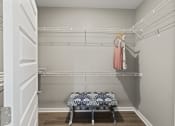 Thumbnail 9 of 38 - a walk in closet with a and a rack with clothes at Central Island Square, Daniel Island, 29492