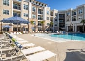 Thumbnail 11 of 38 - Sparkling pool with sun loungers  at Central Island Square, South Carolina