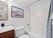 Thumbnail 7 of 25 - a white bathroom with a tub and a toilet and a sink at Courthouse Square Apartments, Towson, MD, 21286