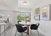 Thumbnail 4 of 25 - a dining room with a table and chairs and a window at Courthouse Square Apartments, Towson, 21286
