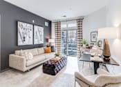 Thumbnail 3 of 18 - living room with blue walls and a couch and a table  at Dartmoor Place at Oxford Square Apartments, Maryland, 21076