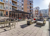 Thumbnail 11 of 18 - Patio at Dartmoor Place at Oxford Square Apartments, Maryland