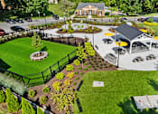 Thumbnail 17 of 25 - a community park with a games, firepit, dog park and a pavilion at Courthouse Square Apartments, Maryland