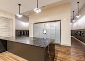 Thumbnail 24 of 26 - A mail/package room with long counter at The Edison Lofts Apartments, Raleigh, NC, 27601