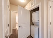 Thumbnail 7 of 26 - A white door is open to reveal a white dishwasher at The Edison Lofts Apartments, Raleigh, NC