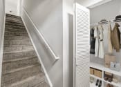 Thumbnail 12 of 41 - a stairwell in a house with a carpeted stairway and a closet on the sideat Fortress Grove, Tennessee, 37128