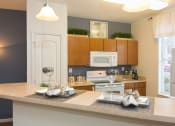 Thumbnail 16 of 41 - a kitchen with a large island with a breakfast bar at Fortress Grove, Murfreesboro, TN