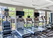 Thumbnail 17 of 27 - Treadmill in gym at The Flats at Ballantyne Apartments, Charlotte, 28277
