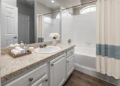 Thumbnail 5 of 22 - A bathroom with a sink at Henley Tampa Palms Apartments, Tampa