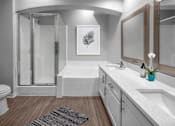 Thumbnail 11 of 22 - a bathroom with a shower and a sink and a mirror at Henley Tampa Palms Apartments, Florida