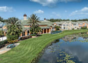 Thumbnail 20 of 22 - a building with a pond in front of it at Henley Tampa Palms Apartments, Tampa, FL, 33647