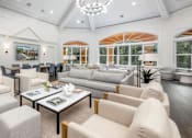 Thumbnail 18 of 22 - a white living room with couches and chairs at Henley Tampa Palms Apartments, Tampa, Florida