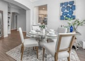Thumbnail 8 of 22 - a dining room with a table and chairs at Henley Tampa Palms Apartments, Tampa, FL