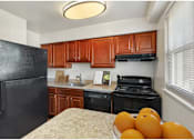 Thumbnail 8 of 19 - Kitchen with breakfast bar at Donnybrook Apartments, Maryland, 21286