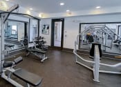 Thumbnail 36 of 54 - Strength equipment in the fitness center   at Two Addison Place Apartments , Pooler, 31322