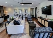 Thumbnail 42 of 54 - Business center sofa seating at Two Addison Place Apartments , Pooler, Georgia