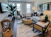 Thumbnail 10 of 54 - Model living room at Two Addison Place Apartments , Georgia
