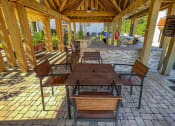 Thumbnail 26 of 54 - Outdoor dining area at Two Addison Place Apartments , Pooler, 31322