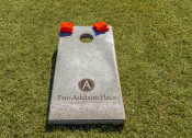 Thumbnail 29 of 54 - Cornhole board and bags in outdoor game area  at Two Addison Place Apartments , Pooler, Georgia