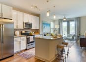Thumbnail 1 of 21 - Kitchen with stainless steel appliances and island at 1010 Dilworth Apartments, Charlotte, NC 28204