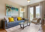 Thumbnail 2 of 21 - Sofa and chair with painting and sliding doors at 1010 Dilworth Apartments, Charlotte, NC