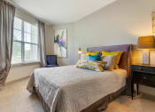 Thumbnail 5 of 21 - Bedroom with nightstand and large window at 1010 Dilworth, Charlotte NC