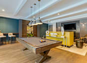 Thumbnail 14 of 21 - clubroom with pool table and seating at 1010 Dilworth Apartments, Charlotte, NC