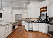 Thumbnail 17 of 26 - Clubhouse kitchen with coffee bar at The Reserve at Mayfaire Apartments, Wilmington NC